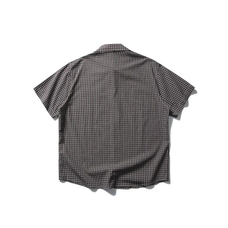 Back view of a short-sleeve plaid outdoor shirt on a white background