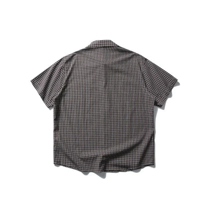 Back view of a short-sleeve plaid outdoor shirt on a white background