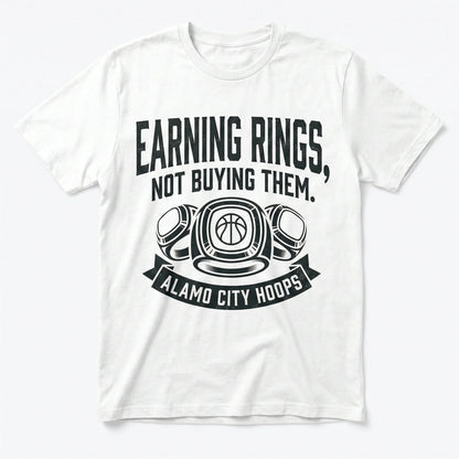 White t-shirt with 'Earning Rings, Not Buying Them. Alamo City Hoops' basketball graphic.