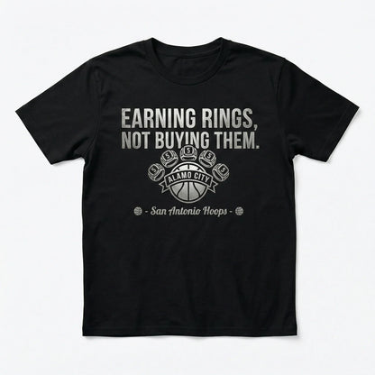 Black t-shirt with 'Earning rings, not buying them' San Antonio Hoops basketball graphic.