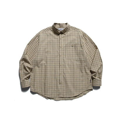 Beige plaid outdoor button-up shirt with chest pocket, laid flat on white background