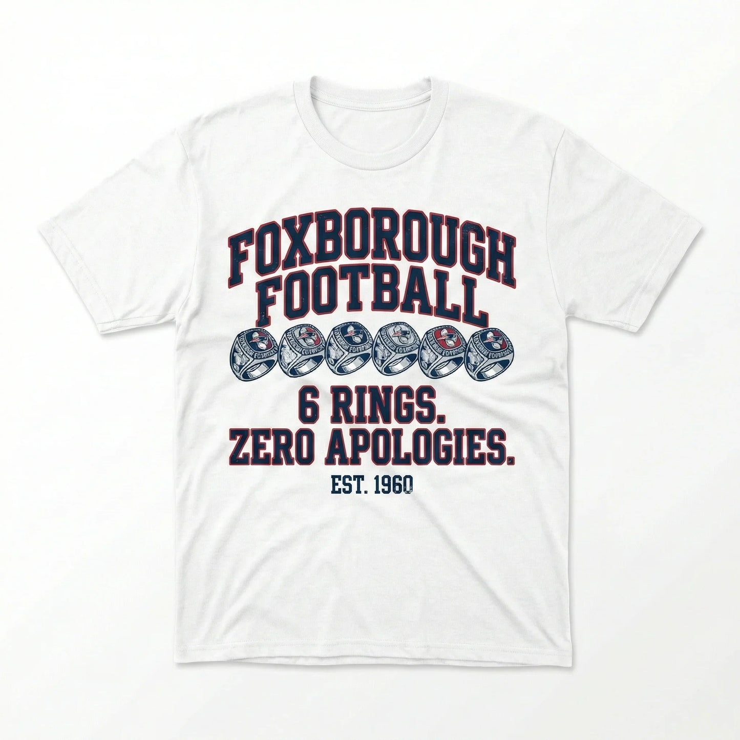 White t-shirt featuring Foxborough Football design with six rings, bold text, and EST. 1960.