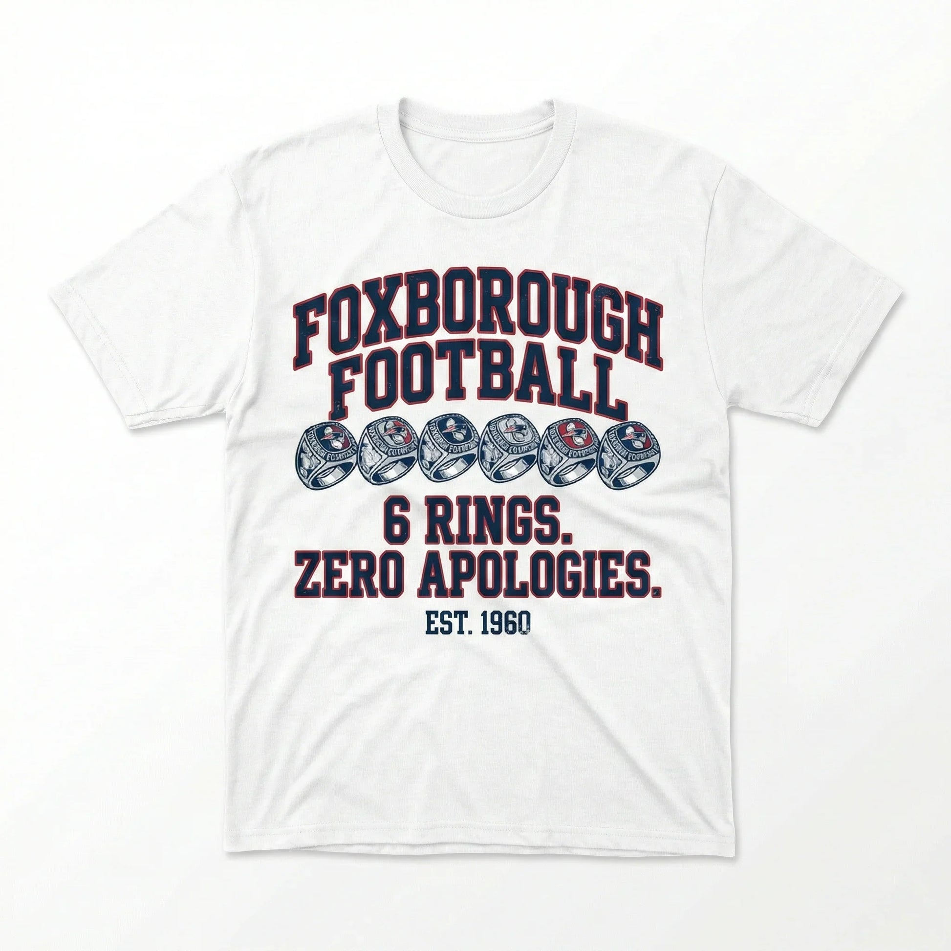 White t-shirt featuring Foxborough Football design with six rings, bold text, and EST. 1960.