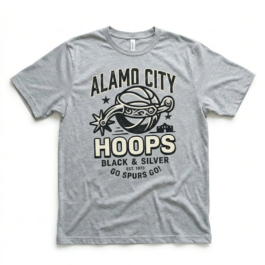 Gray t-shirt with Alamo City Hoops basketball graphic, text in black and cream lettering.
