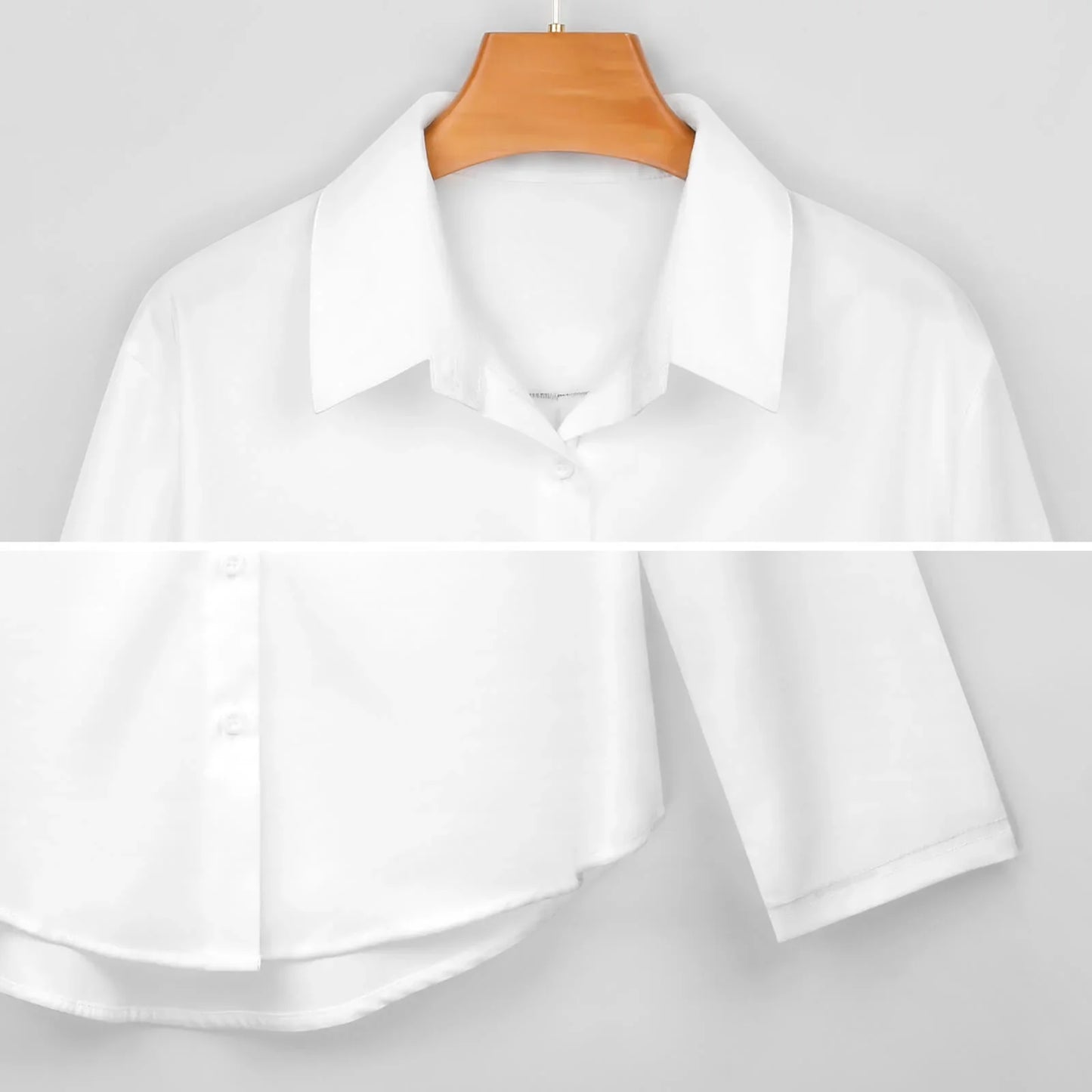 White button-down shirt with classic collar and short sleeves on wooden hanger