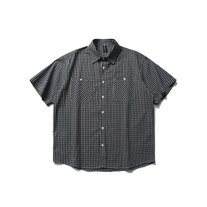 Black and white plaid short sleeve button-up shirt with two front chest pockets