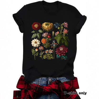 Black t-shirt featuring colorful vintage botanical flower illustrations, laid flat.