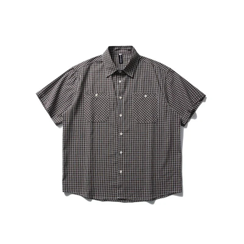 Short-sleeve plaid outdoor shirt with button front and chest pockets on white background