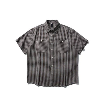 Short-sleeve plaid outdoor shirt with button front and chest pockets on white background