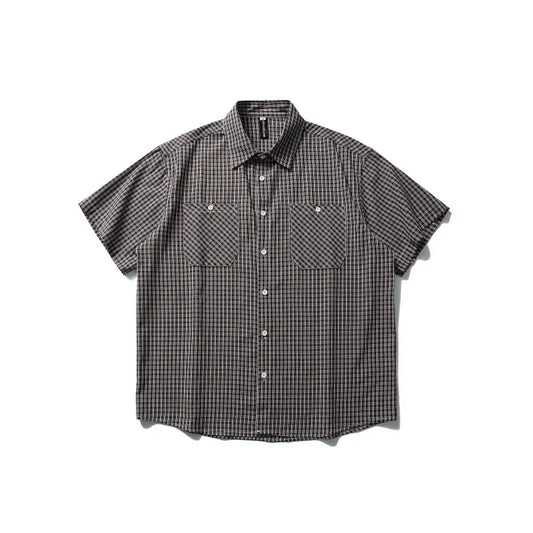 Short-sleeve plaid outdoor shirt with button front and chest pockets on white background