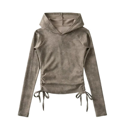 Taupe long sleeve hooded top with ruched sides and adjustable drawstring ties, flat lay