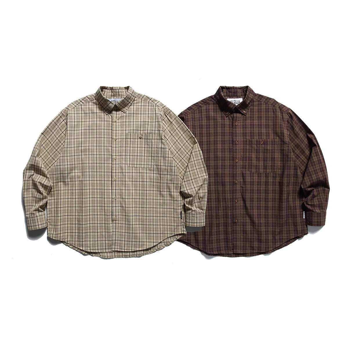 Two long-sleeve plaid button-up shirts in beige and brown on white background
